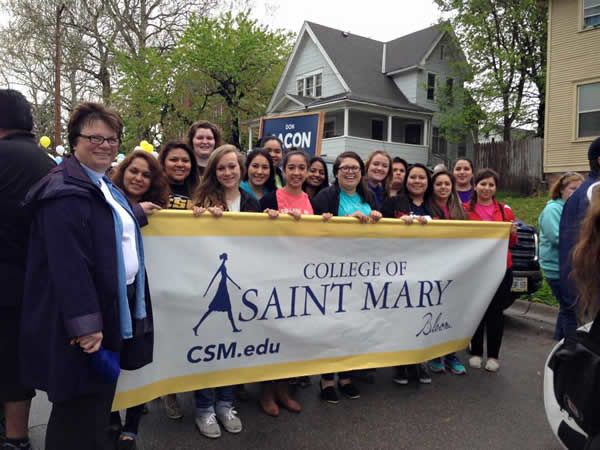 President Stevens at Cinco de Mayo parade with students