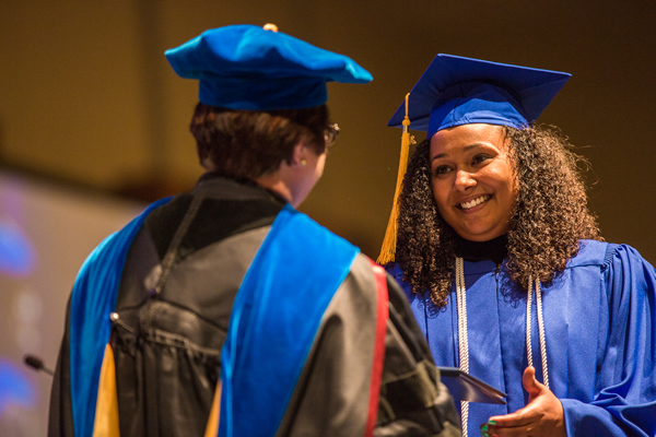 President Maryanne Stevens congratulates a graduate